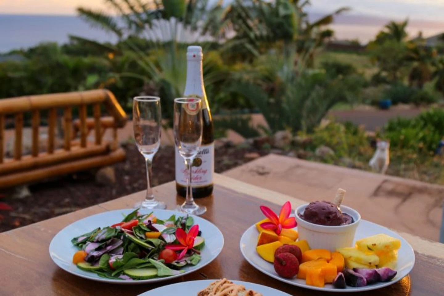 Maui farm-to-table dinner with tropical fruit and ocean-view setting